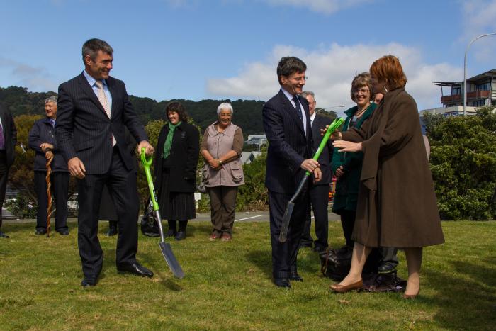 Arts Culture and Heritage Minister Chris Finlayson hands a spade to Wellington Mayor Celia Wade-Brown during the turf-turning ceremony at the site of the National War Memorial Park in Wellington. Veterans’ Affairs Minister Nathan Guy and local kaumatua look on.