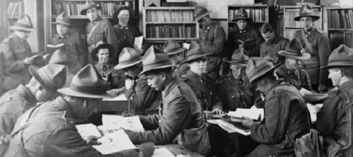 Soldiers in a library reading