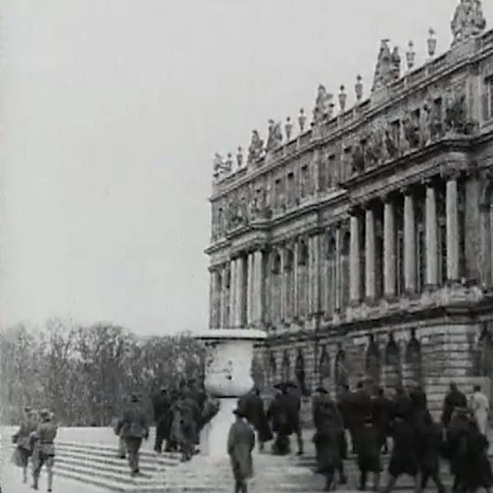 Visitors walking outside the Palace of Versailles in 1919